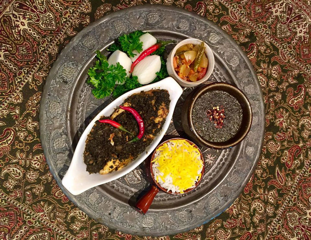 9) Ghalieh Mahi (Spicy Fish with fresh herbs)